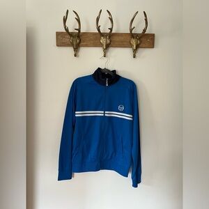 Live out your 80’s Sergio Tacchini dreams in this beauty!